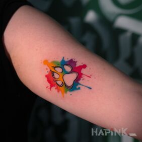 Tattoo Colorful paw on the bicep motif: animals style: Watercolor