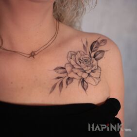 Tattoo Rose Flower on the collarbone motif: black and gray style: realistic