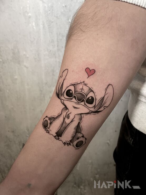 Tattoo Stich <3 in black and gray motif and graphic / illustrative style On the arm