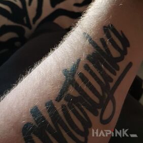 Tattoo Caption on the forearm motif: lettering