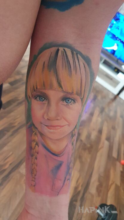 Tattoo Po delikatnych poprawkach. in faces motif and realistic style On the arm