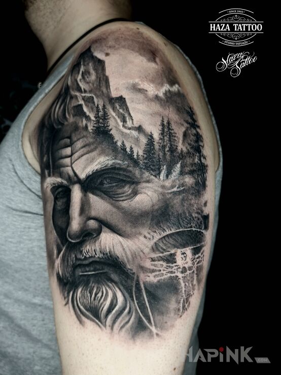 Tattoo Odin in characters motif and realistic style On the arm