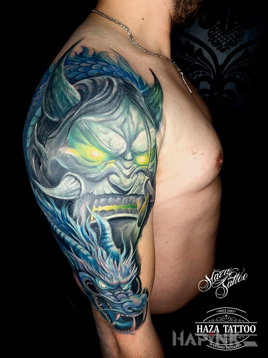 Tattoo Japanese demon in fantasy motif and graphic / illustrative style On the arm