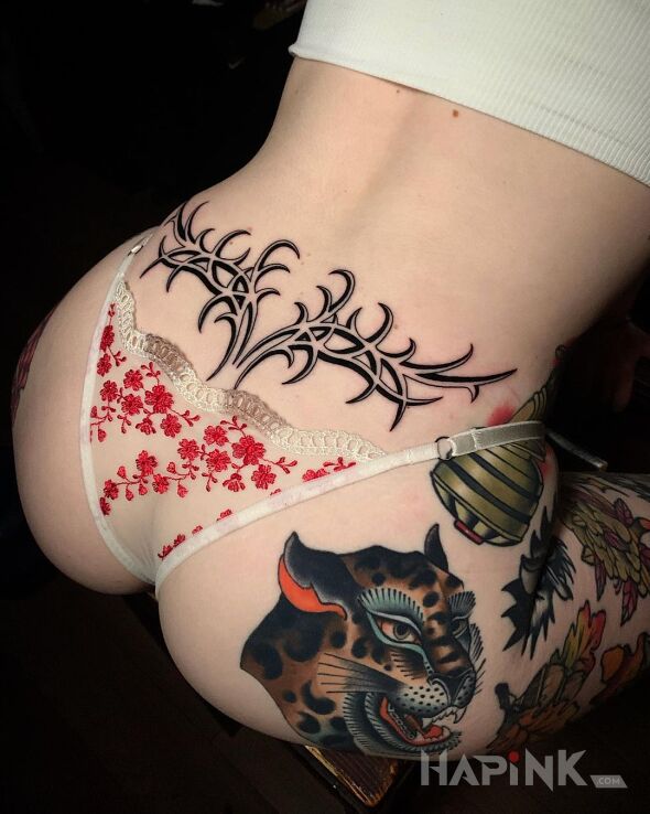 Tattoo Różki in sexy motif and neo tribal style on the buttocks
