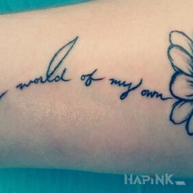 Tattoo Inscription with a flower on the forearm motif: flowers
