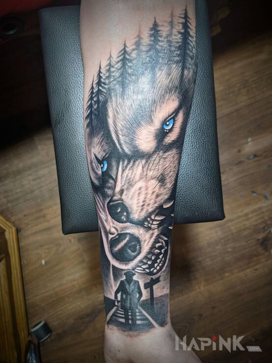 Tattoo Dwa wilki in characters motif and realistic style on the forearm