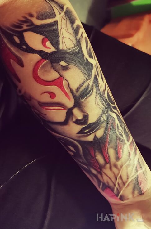 Tattoo Diablica in faces motif and graphic / illustrative style On the arm
