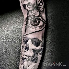 Tattoo Skull on the forearm motif: flowers style: realistic