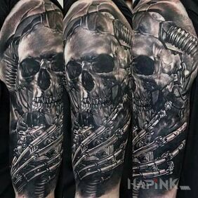 Tattoo Metallic skull on the upper arm motif: anatomical style: realistic