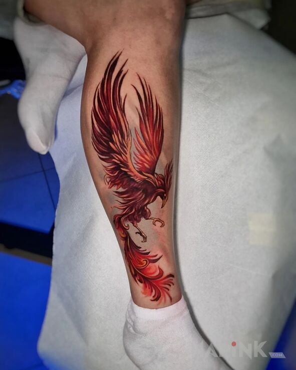 Tattoo Feniks na nodze in animals motif and graphic / illustrative style on the calf