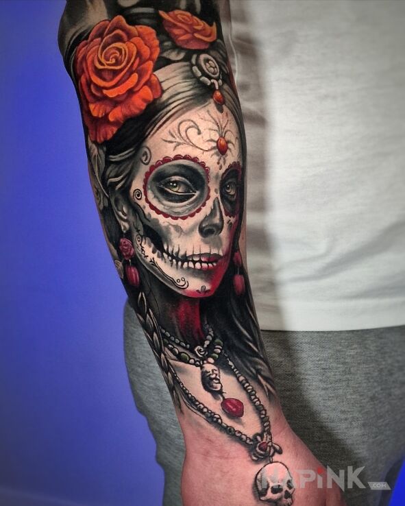 Tattoo Santa muerte na przedramieniu in flowers motif and Watercolor style on the forearm