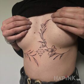 Tattoo Flowers between the breasts on the stomach style: geometric