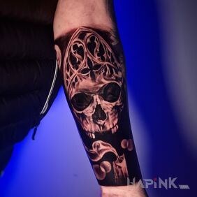 Tattoo Skull on the forearm On the arm motif: dark style: realistic