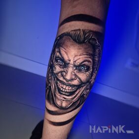 Tattoo Joker on the leg on the calf motif: faces style: realistic