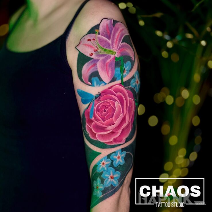 Tattoo Kolorowe kwiaty in floral motif and realistic style On the arm