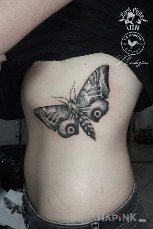 Tattoo Ćma in butterflies motif on the ribs