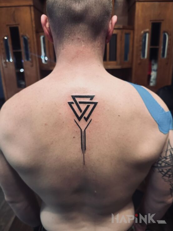 Tattoo Valknut in black and gray motif and geometric style on the back