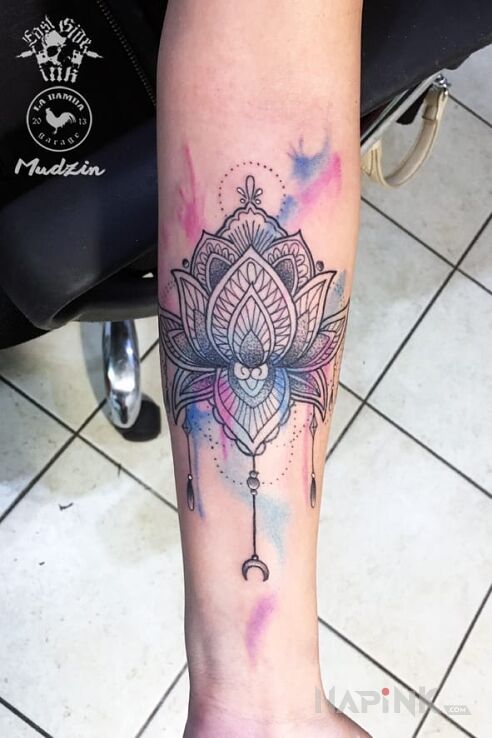 Tattoo Mandala watercolor in colorful motif and Watercolor style on the forearm