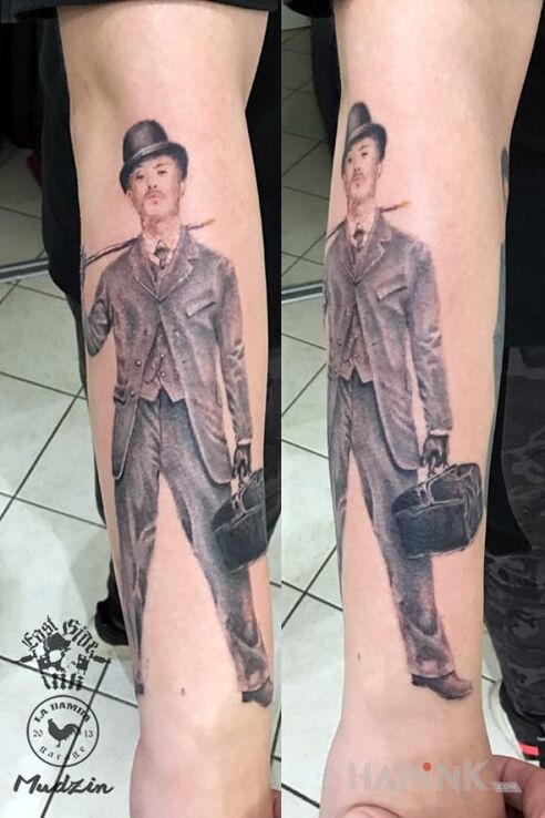 Tattoo Watson Scherlock Holmes in characters motif and realistic style on the forearm