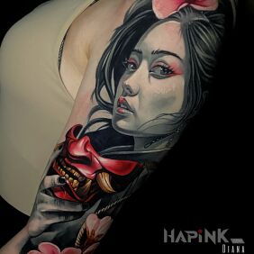 Tattoo Geisha on the upper arm motif: flowers style: realistic