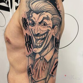 Tattoo Joker dc On the arm motif: faces style: graphic / illustrative