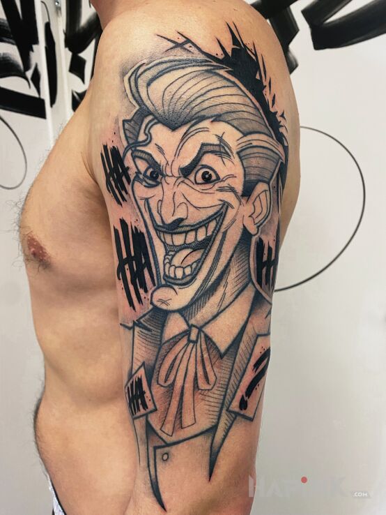 Tattoo Joker dc in faces motif and contour / linework style On the arm