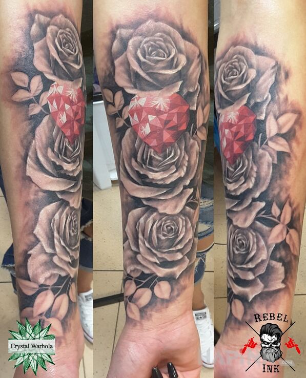 Tattoo Różyczki in flowers motif and realistic style on the forearm