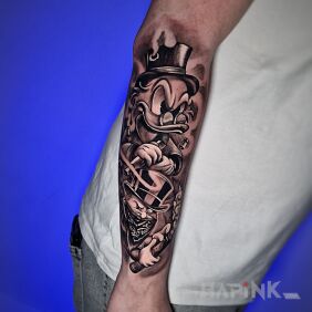 Tattoo Monopoly forearm tattoo on the forearm motif: characters style: graphic / illustrative