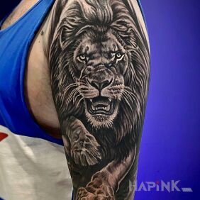 Tattoo The lion and its mighty paws on the forearm motif: zodiac signs style: realistic