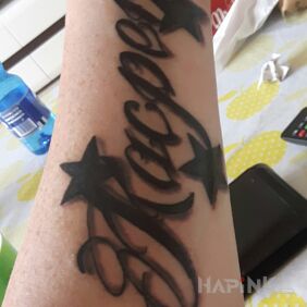 Tattoo Son on the forearm motif: lettering