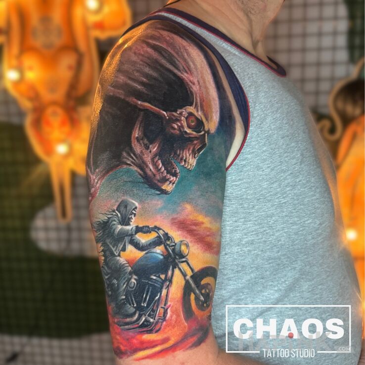 Tattoo Ghost rider in demons motif and realistic style On the arm