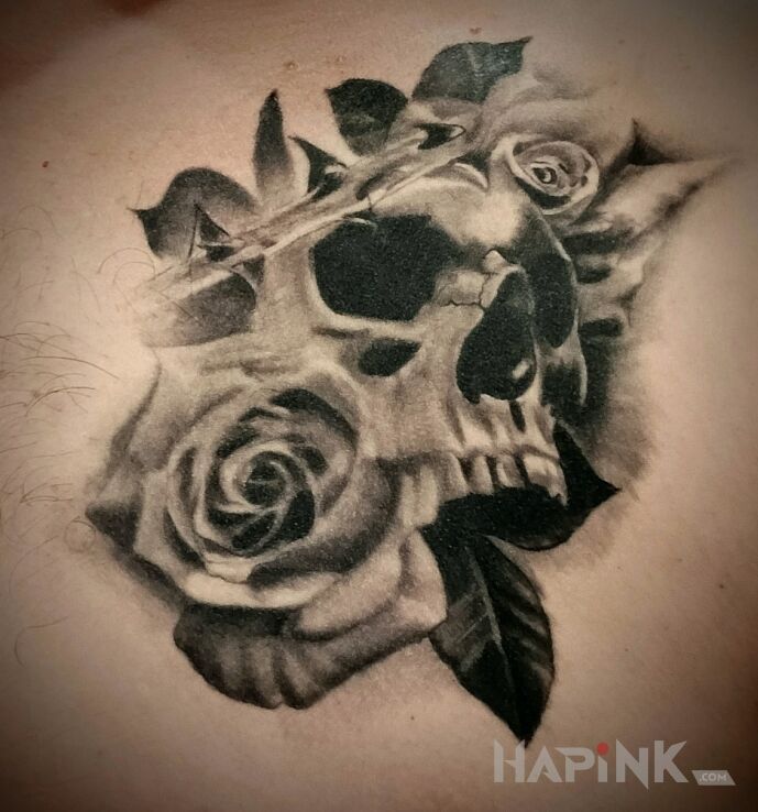 Tattoo Czaszka z różą in black and gray motif and realistic style on the chest