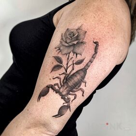 Tattoo Scorpion with a rose On the arm motif: flowers style: realistic