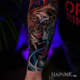 Tattoo Tiger On the arm motif: colorful style: realistic