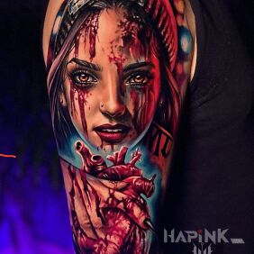 Tattoo Woman with a heart in her hand On the arm motif: dark style: realistic