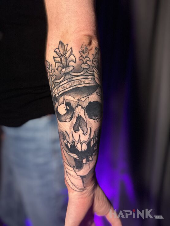 Tattoo Skull woman in dark motif and graphic / illustrative style On the arm