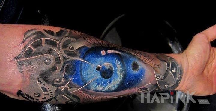 Tattoo Tryby in colorful motif and biomechanics style on the forearm