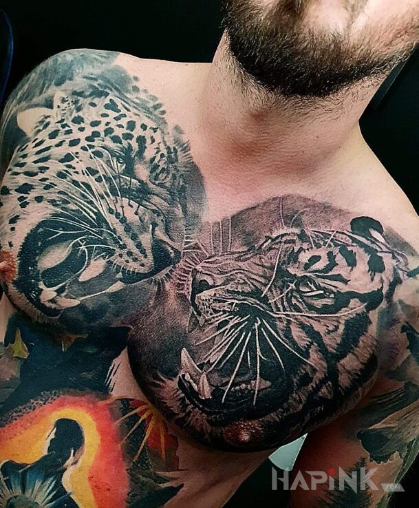 Tattoo Kocury dzikie in black and gray motif and realistic style on the chest