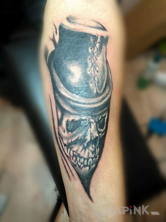 Tattoo Dziara M in skulls motif on the forearm