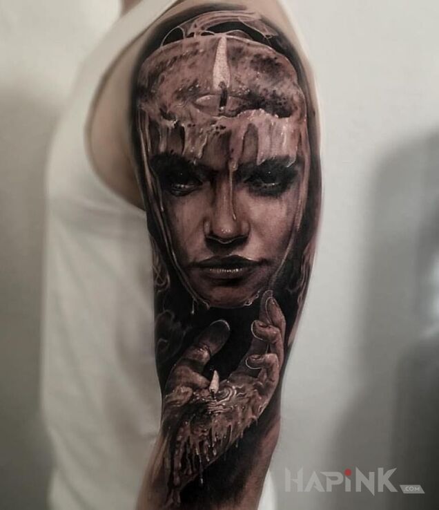 Tattoo Kobieta z wosku in faces motif and realistic style on the upper arm