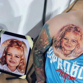 Tattoo Daughter's portrait on the chest motif: colorful style: realistic