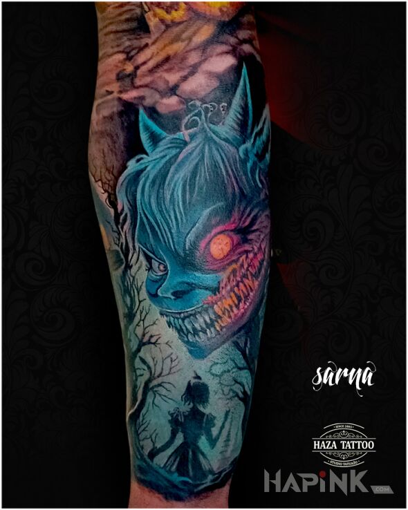 Tattoo Alice in Wonderland color in faces motif and graphic / illustrative style on the forearm
