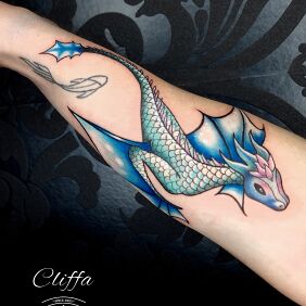 Tattoo Dragon on the forearm motif: colorful style: graphic / illustrative