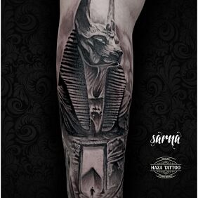 Tattoo Anubis on the forearm motif: characters style: realistic