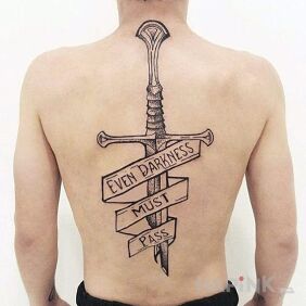 Tattoo Inscription and sword on the back motif: lettering