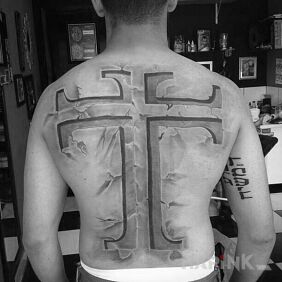 Tattoo Cross on the back motif: religious