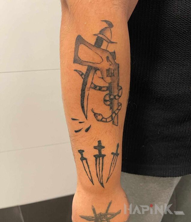Tattoo Tatuaż inspirowany polskim tatuażem kryminalnym. in black and gray motif and graphic / illustrative style On the arm