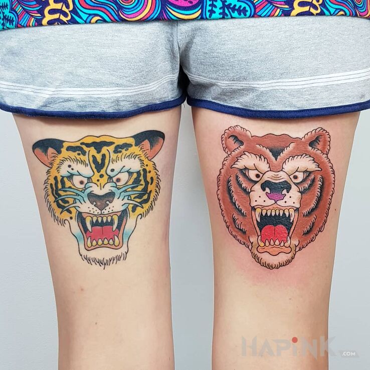 Tattoo Tygrys i niedźwiedź in colorful motif and oldschool style on the leg