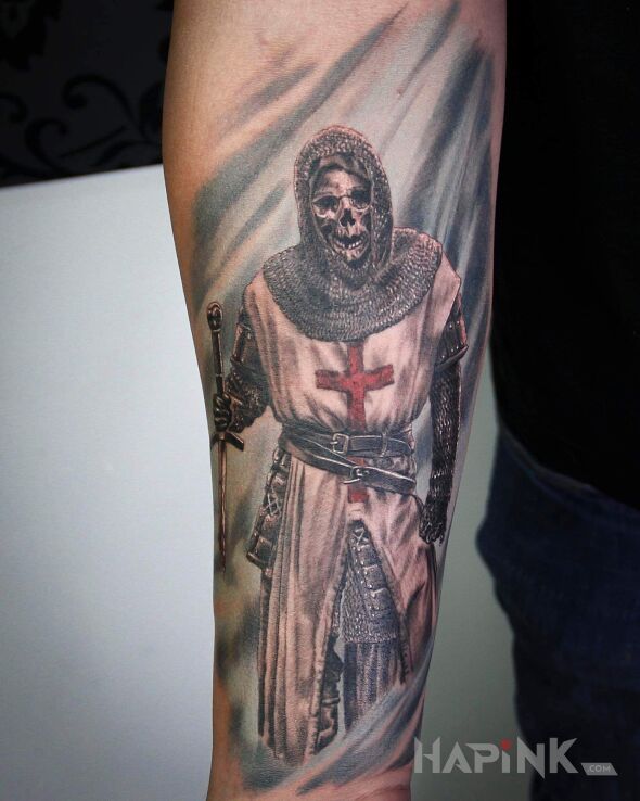 Tattoo Templetariusz in religious motif and realistic style on the forearm