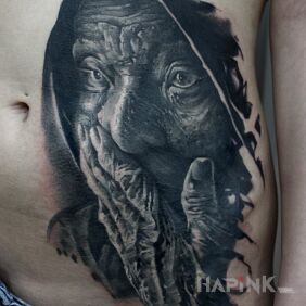 Tattoo Old Lady on the stomach motif: black and gray style: realistic